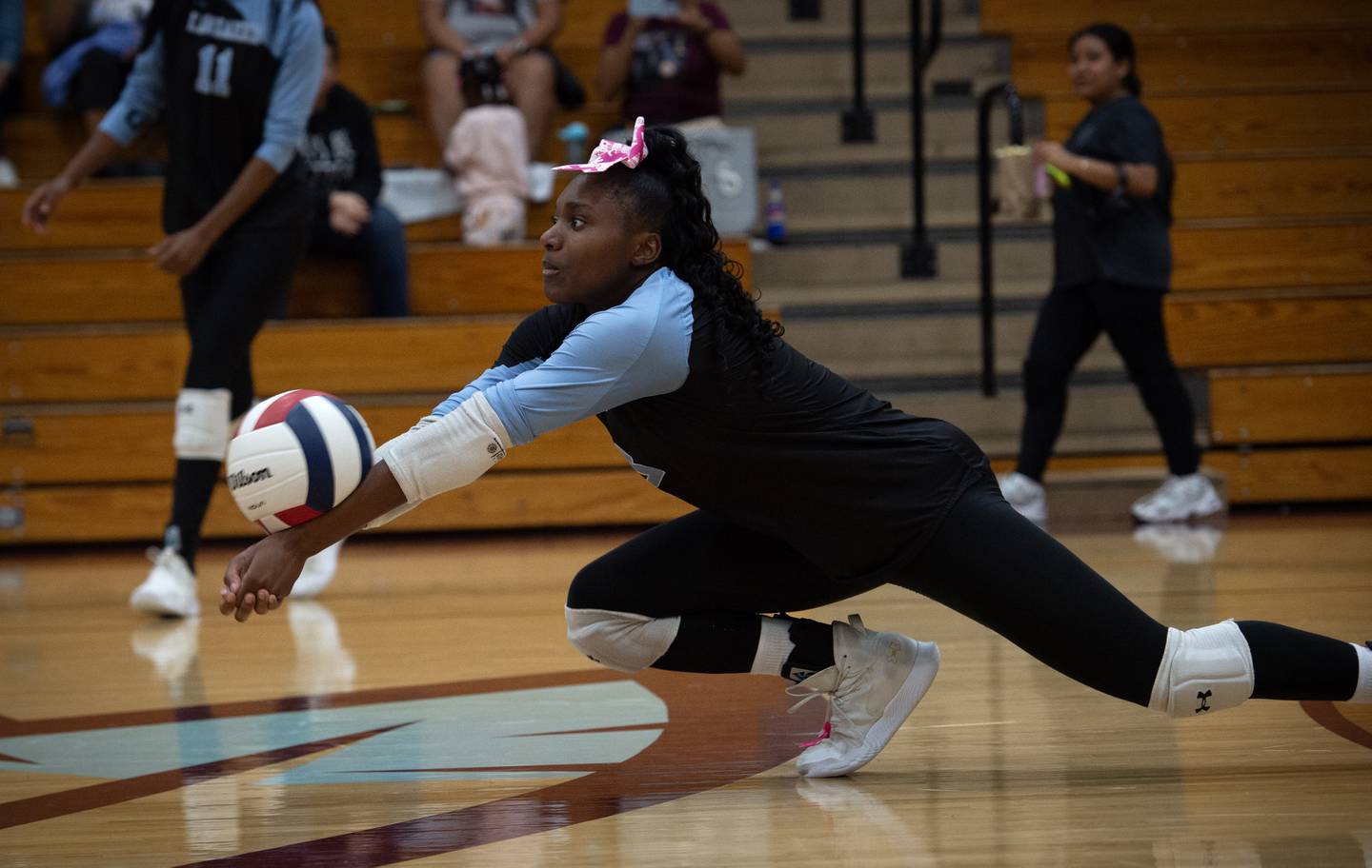 Kankakee's Erin Wills lunges to make a return hit in a match against Bloom on Tuesday, October 14, 2025.