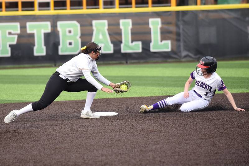 Bishop McNamara's Gabby Burnett, left, reaches to extend a tag on Wilmington's Nina Egizio at second base at the Class 2A Seneca Regional semifinals Tuesday, May 19, 2026.