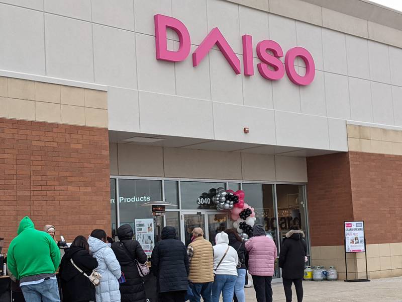 People stand in line on Feb. 8 waiting for Daiso to open its new store at 3040 Route 34 in the Oswego Commons shopping center.
