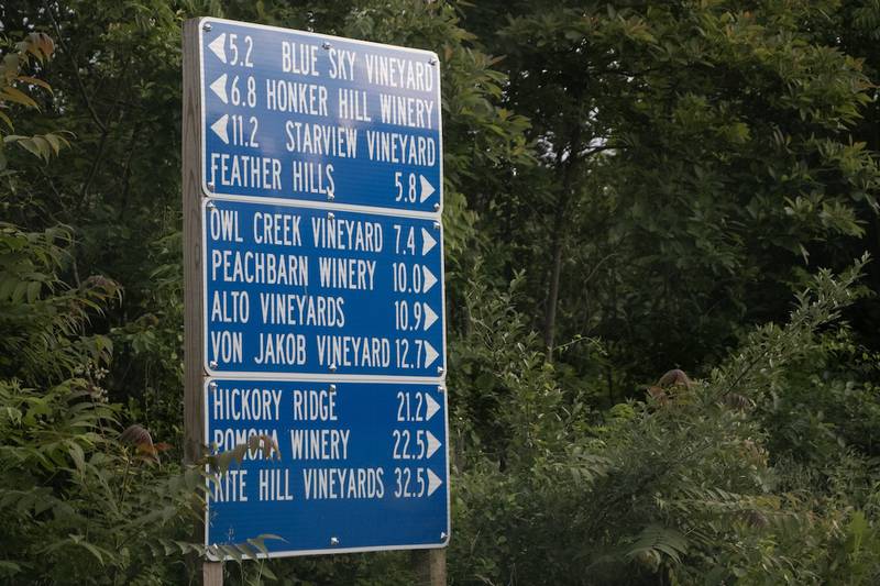 Road sign points to wine trail locations along the Shawnee Hills Wine Trail.