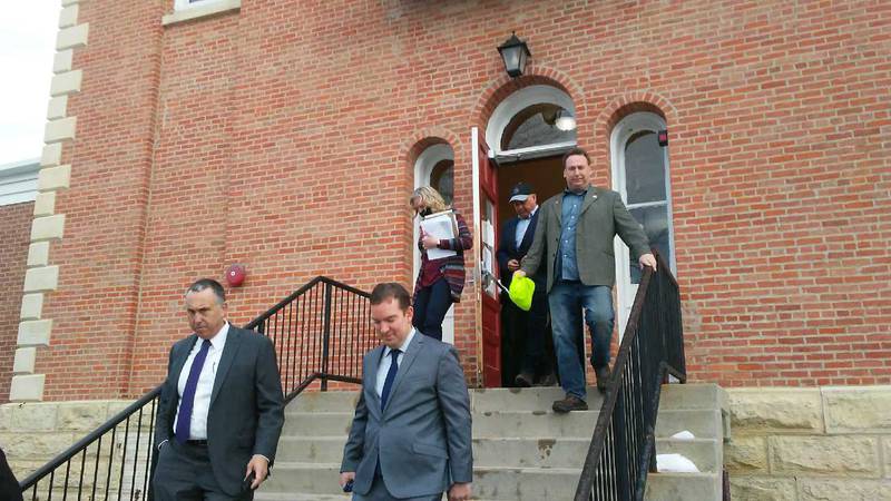 Kendall County State's Attorney Eric Weis, left, and county board Chairman Scott Gryder lead the way out of the Kendall County Historic Courthouse, followed by County Clerk Debbie Gillette and county board members Ruben Rodriguez and Dan Koukol on Jan. 18. (Mark Foster mfoster@shawmedia.com)