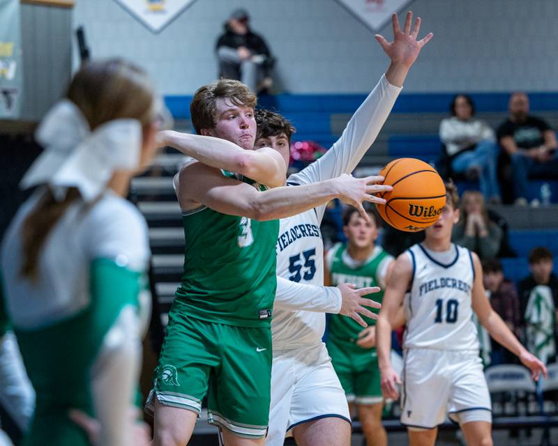 Collin Bachand (3) of Dwight whips ball towards teammate saving it from falling out of bounds on Monday, December 15, 2025 at Fieldcrest High School in Minonk.