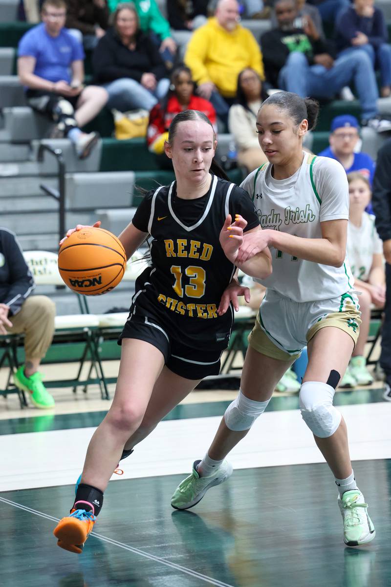 Reed-Custer's Atiana Hood drives to the lane against Bishop McNamara's Jaide Burse during Bishop McNamara's 60-36 victory over Reed-Custer in the IHSA Class 2A Bishop McNamara Regional semifinals on Monday, Feb. 16, 2026.
