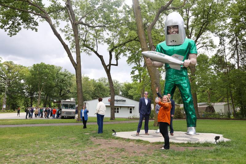 Elaine Bottomley, right, Deputy Chief of Staff at the Office of the Will County Executive, takes a selfie with her co-workers and the Gemini Giant during The Landing Pad Souvenir Shop's official ribbon-cutting ceremony at Wilmington's South Island Park on Thursday, May 22, 2025.