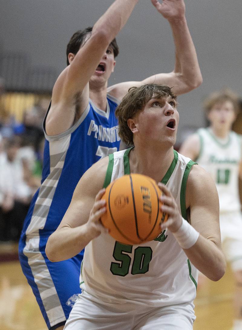 Rock Falls’ Cole Mulnix works below the basket against Princeton Friday, March 7, 2025, in the Class 2A boys basketball Sectional final in Marengo.