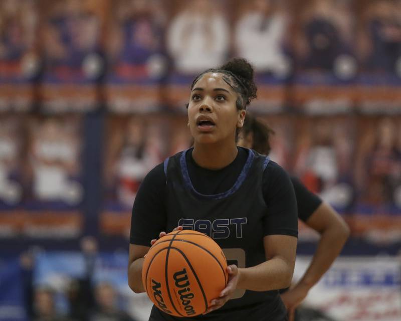 Oswego East's Inspire Fisher (23) shoots a free throw during their basketball game between Oswego East at Oswego Friday, Jan 09, 2026 in Oswego.