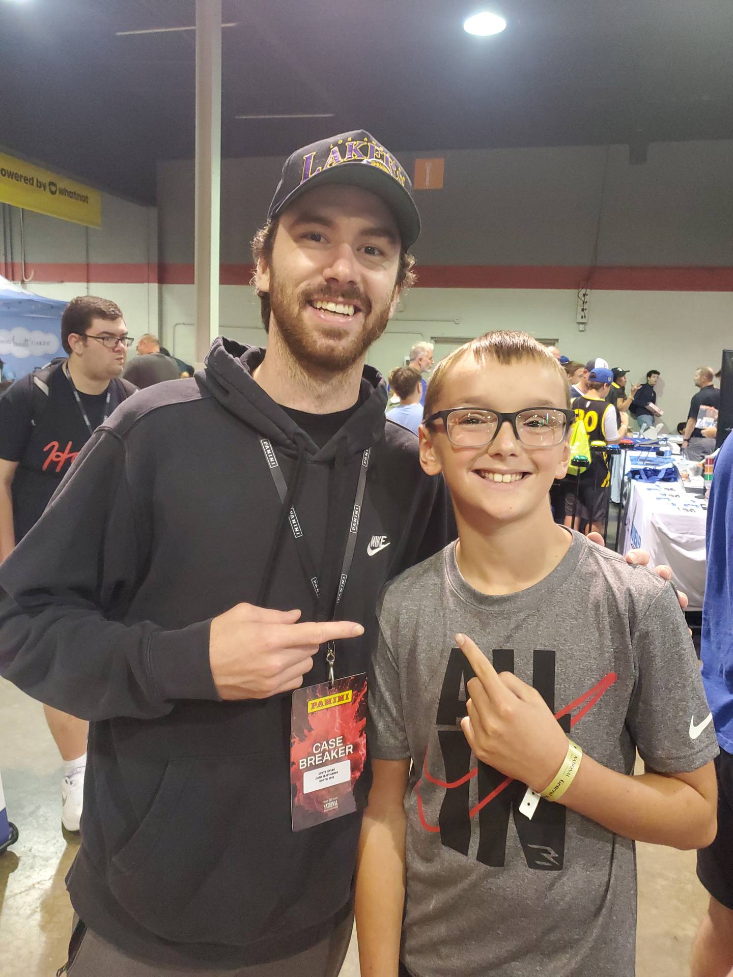 Coyte Kyles, left, poses for a photo with Ethan Kohn, 10, of Clifton, at the 45th National Sports Card Convention at the Donald E. Stephens Convention Center in Rosemont Saturday, Aug. 2, 2025.