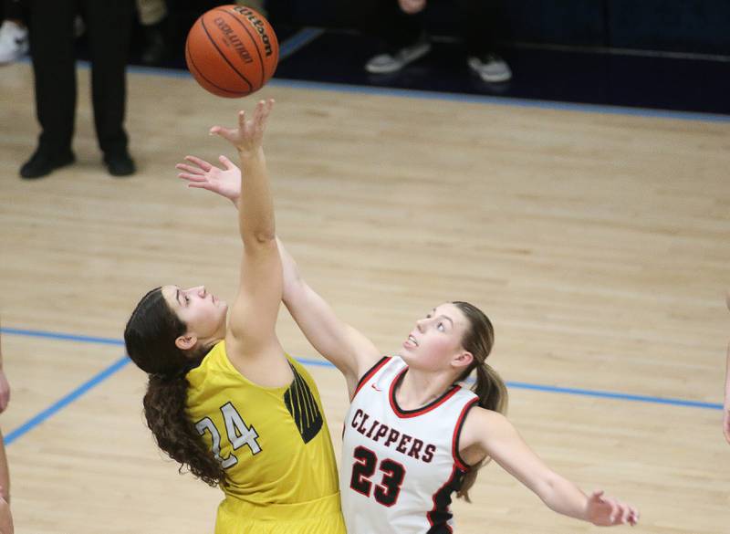 Putnam County's Maggie Richetta wins a jump ball over Amboy's Maeve Larson during the Class 1A Regional semifinal game on Monday, Feb. 12, 2024 at Marquette High School.