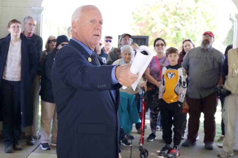 Dennis Maher, from the Sons of Union Veterans talk to visitors at Elmwood Cemetery in Sycamore Sunday, Oct. 9, 2022, during the Etched in Stone cemetery walk. The event, hosted by the DeKalb County History Center, told the stories of some local individuals who are buried there.