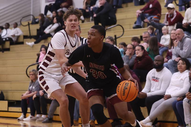 Plainfield North’s Pierre Pointer works the ball against Lockport on Friday, Jan. 3, 2025 in Lockport