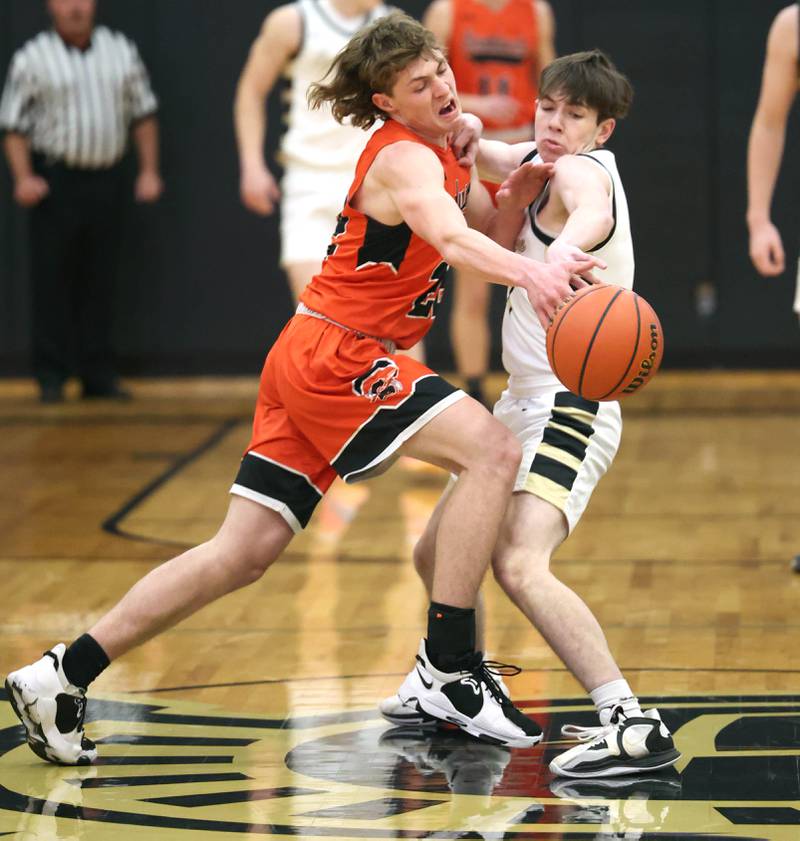 Sandwich's Austin Marks (left) and Sycamore's Jaxon Tierney collide during their game Tuesday, Jan. 17, 2023, at Sycamore High School.