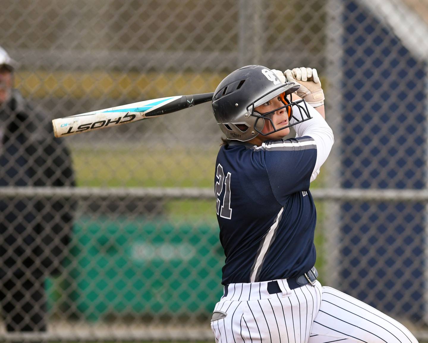Oswego East’s Ryenne Sinta (21) watches the ball after making contact with the ball during the game on Thursday April 17, 2025, while taking on Plainfield North held at Oswego East High School.