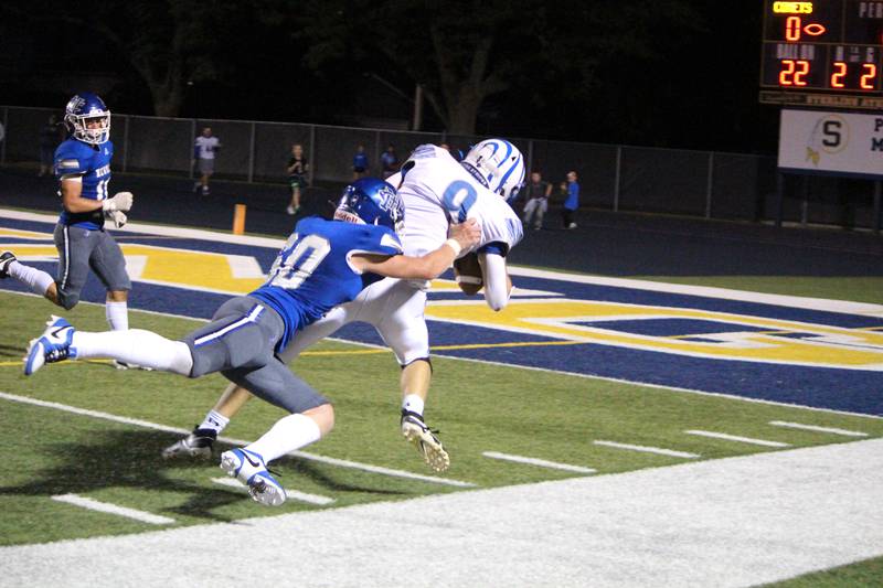 Newman’s Caleb Donna tackles Princeton’s Arthur Burden during a game at Newman on Friday, Sept. 8, 2023.