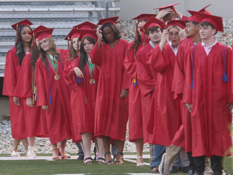 La Salle-Peru Township High School graduates walk to receive their diplomas during the L-P Class of 2026 commencement ceremony on Thursday, May 14, 2026 at Howard Fellows Stadium.