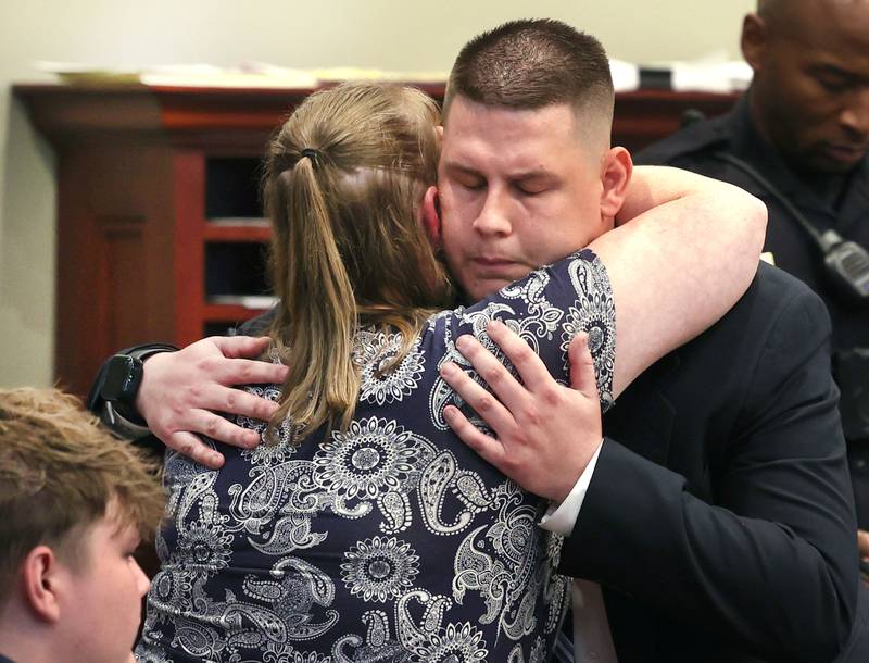 Former police officer James Corralejo (right) hugs his mom Wendy Corralejo before he is taken into custody Thursday, July 17, 2025, at the DeKalb County Courthouse in Sycamore. James Corralejo was sentenced to four years in prison for a Class 2 felony count of driving under the influence of alcohol causing death for a 2023 crash that killed DeKalb woman Graciela Reza Contreras.