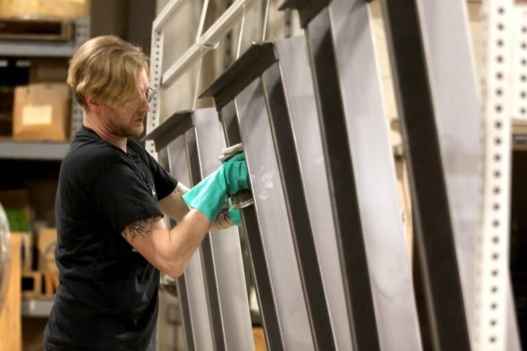 Benjamin Sams prepares units for powder coating at MAC Automation Concepts Monday. Educators from Huntley and Harvard toured the facility as part of a Monday kick-off event for the ABC influencers, who are affiliated with the Community Foundation for McHenry County. “ABC" stands for "Area Business Connect,” and the event included tours and Q&A sessions at MAC Automation Concepts and Flocon Solutions in Woodstock.