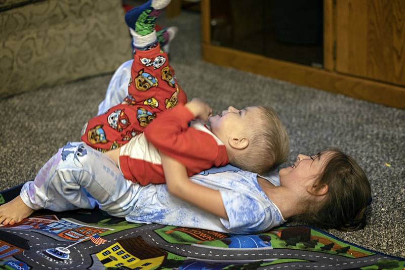 Nastya, 7, plays with little brother Bohdon, 3, at their Dixon home.