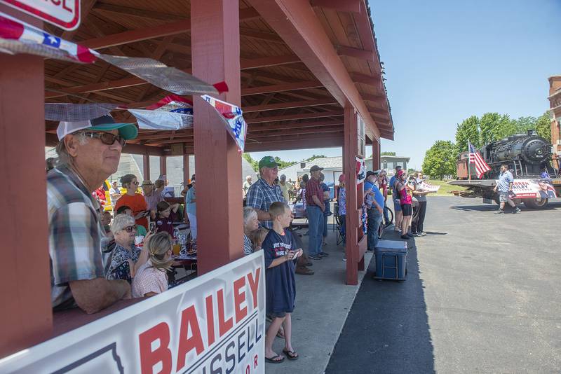 About 100 people wait for the gubernatorial candidate Darren Bailey as he makes a stop at the Amboy Depot Museum Friday, June 17, 2022. The republican made a stop in Byron and Sterling in addition to Amboy.