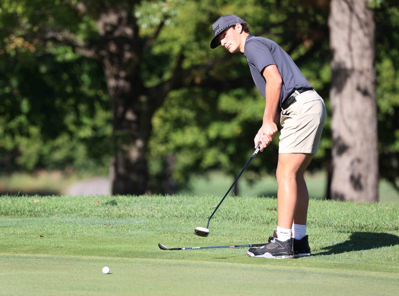 Sycamore’s Eli Goodeill putts from the fringe of the third green Monday, Sept. 23, 2024, during the Interstate 8 boys golf tournament at the Kishwaukee Country Club in DeKalb.