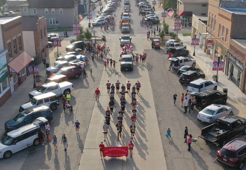 The Hall Marching Red Devils walk down West St. Paul Street during the Homecoming parade on Thursday, Sept. 18, 2025 downtown Spring Valley.