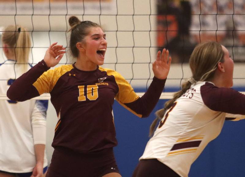 Richmond-Burton’s Daniella Mazzola and the Rockets celebrate a point in varsity girls volleyball at Johnsburg High School in Johnsburg on Thursday, August 25, 2025.