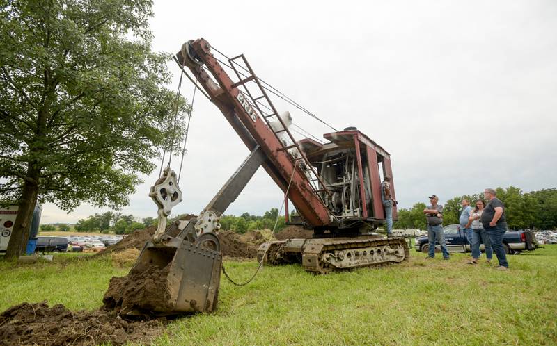 Liam Dancy of Danville speaks about the rare 1925 Erie Steam Shovel on display at the Annual Sycamore Steam Show in Sycamore on Friday, Aug. 12, 2022.