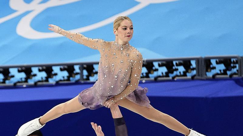 Alexa Knierim, top, and Brandon Frazier, of the United States, compete in the pairs team free skate program during the figure skating competition at the 2022 Winter Olympics, Monday, Feb. 7, 2022, in Beijing.