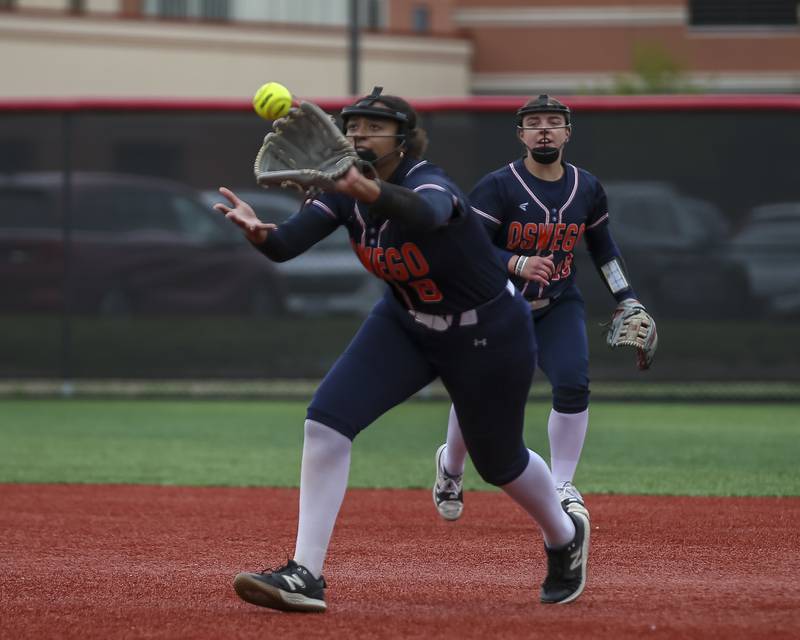 Oswego's Ahlivia East (8) catches a soft liner to first during softball game between Oswego at Yorkville. May 5, 2026 in Yorkville.