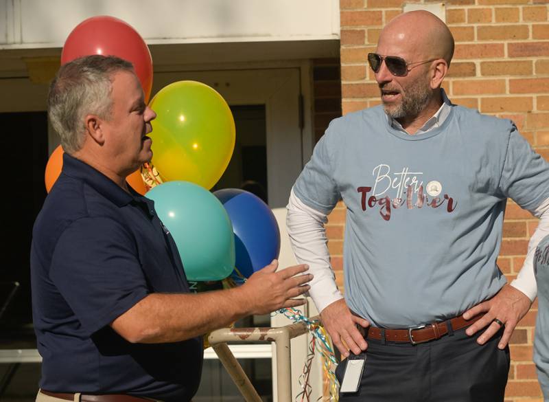 St. Charles Mayor Clint Hull and District 303 Superintendent Dr. Paul Gordon chat before welcoming students to Davis Elementary for the first day of class on Wednesday, Aug 13, 2025.