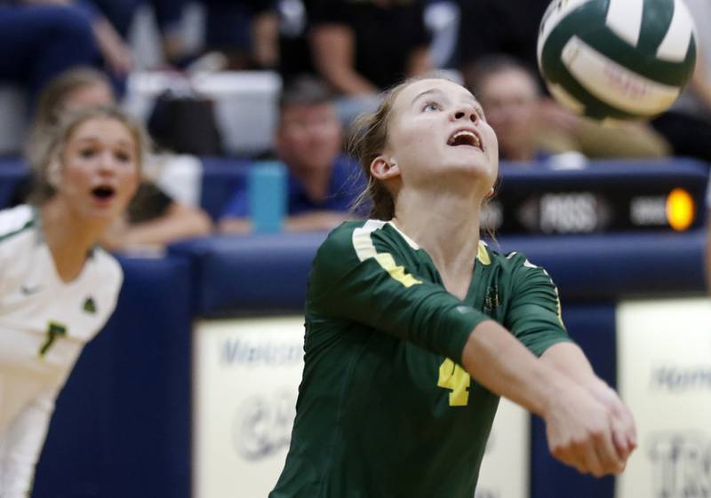Crystal Lake South’s Kaitlyn Brandt bumps sets the ball as her teammate, Gabby Wire watches during a Fox Valley Conference volleyball match Thursday, Aug. 25, 2022, between Cary-Grove and Crystal Lake South at Cary-Grove High School.