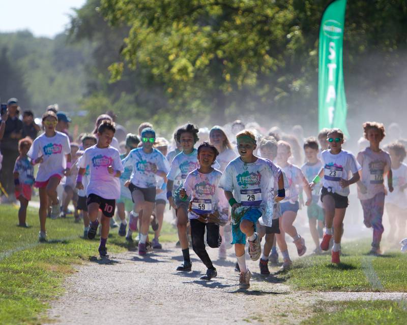Kids race for the colors at the Glen Ellyn 2K Kids Color Bash Run on Saturday Aug.10, 2024 at Ackerman Park in Glen Ellyn.