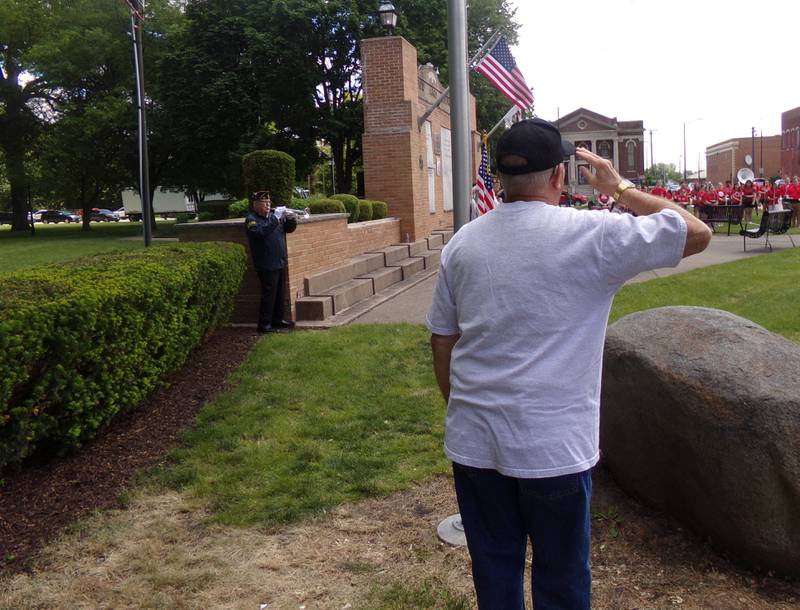Bob Harrison gives a salute as Tom Rice (to the left) performs taps Monday, May 27, 2024, during the Memorial Day ceremony at Veterans Memorial Plaza in Streator's City Park.