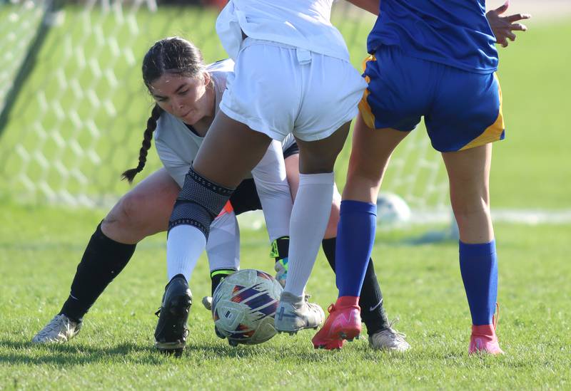 Woodstock’s goalie Erin Doherty makes a save in varsity soccer on Wednesday, April 23, 2025, at Johnsburg High School in Johnsburg.