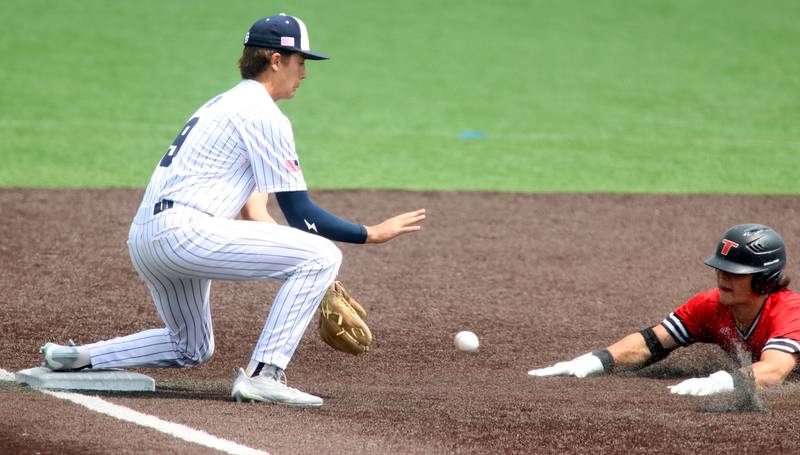 Cary-Grove’s Ricky Barnes fields the throw as Triad’s Landon Loomis arrives safely at third base in IHSA Class 3A Third Place Game baseball action at Slammer Stadium in Joliet on Saturday, June 14, 2025.