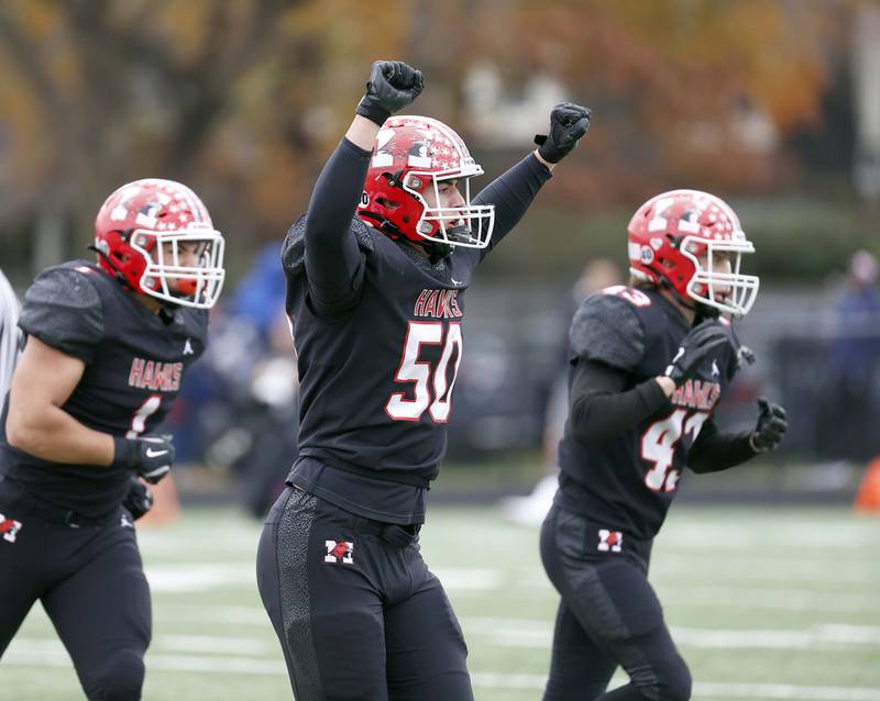 Maine South's Dean Arvanitis (50) celebrates a big stop during the IHSA Class 8A second round playoff game Saturday, Nov. 9, 2024 in Park Ridge.