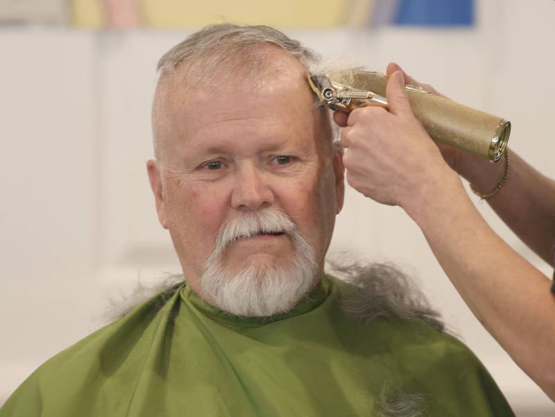 Utica firefighter Lisle Elsbury, has his head shaved during the 19th annual Illinois Valley Emergency Services Annual St. Baldrick's Event on Sunday, March 22, 2026 at Senica's Oak Ridge in La Salle.