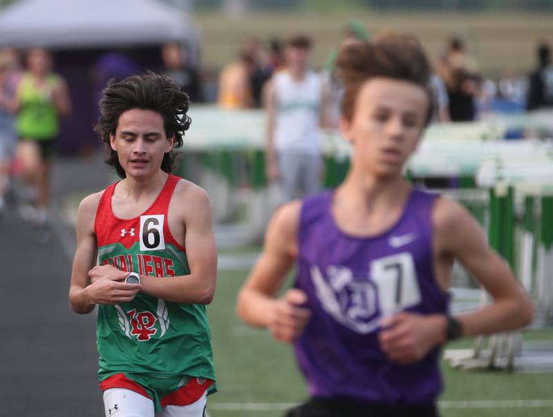 L-P's Erik Garcia competes in the 3200 meter run during the Class 2A track sectional meet on Wednesday, May 17, 2023 at Geneseo High School.