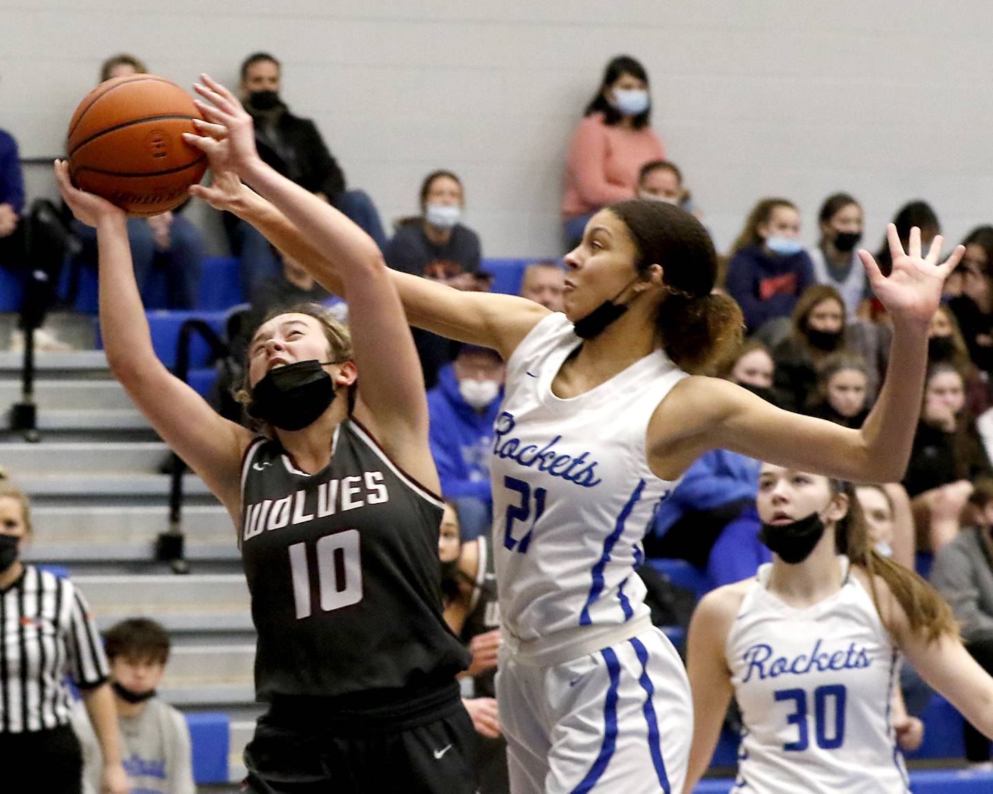 Prairie Ridge's Elani Nanos has her shot blocked by Burlington Central's Taylor Charles during Fox Valley Conference girls basketball game Monday evening, Jan. 31 2022, between Prairie Ridge and Burlington Central at Burlington Central High School.