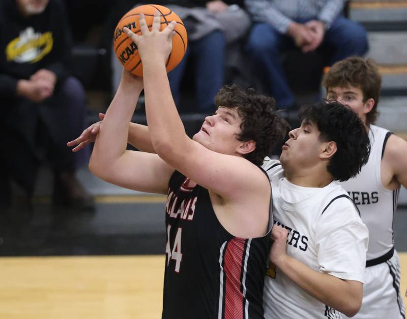 Henry-Senachwine's Bobby Gaspardo eyes the hoop as Putnam County's Juan Ramirez draws a foul on Friday, Dec. 5, 2025 at Putnam County High School.