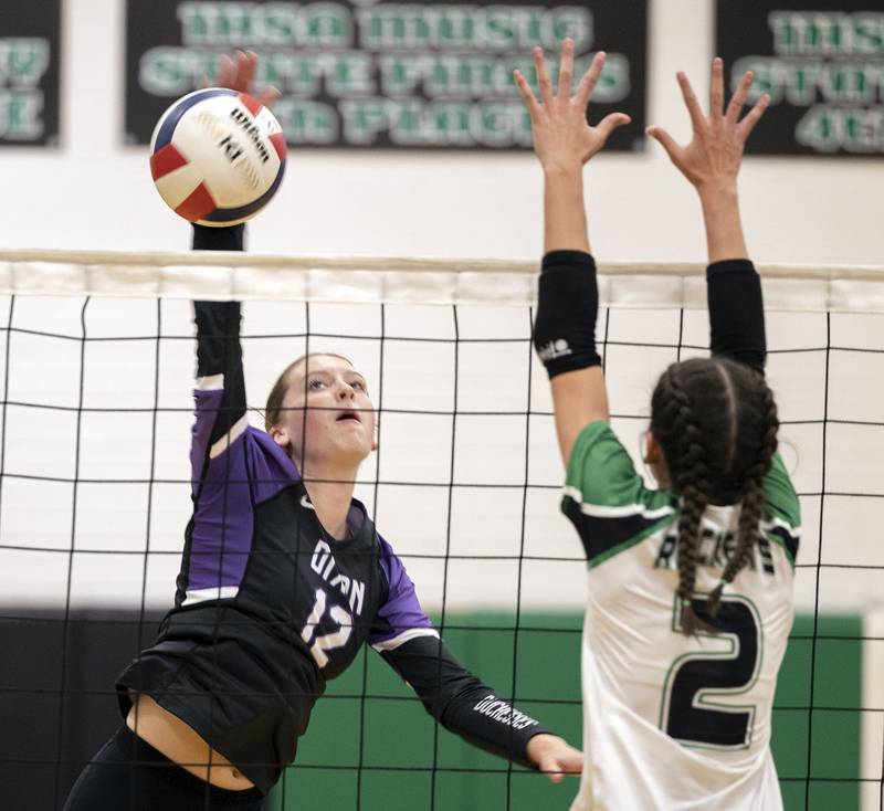 Dixon’s Isabelle Quackboerner hammers the ball against Rock Falls’ Kaltrina Lecaj Thursday, Sept. 19, 2024, in a Big Northern Conference match at RFHS.