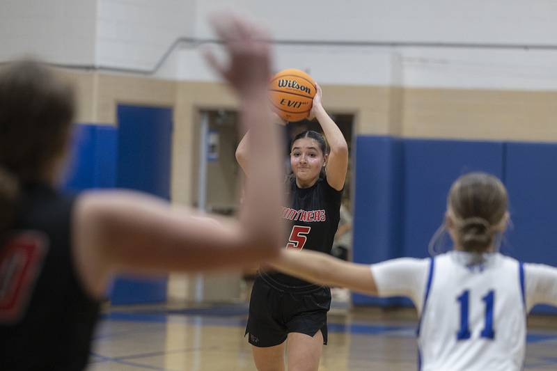 Erie-Prophetstown’s Ashlyn Johnson makes a pass against Newman Thursday, Dec. 12, 2024, at Newman High School.