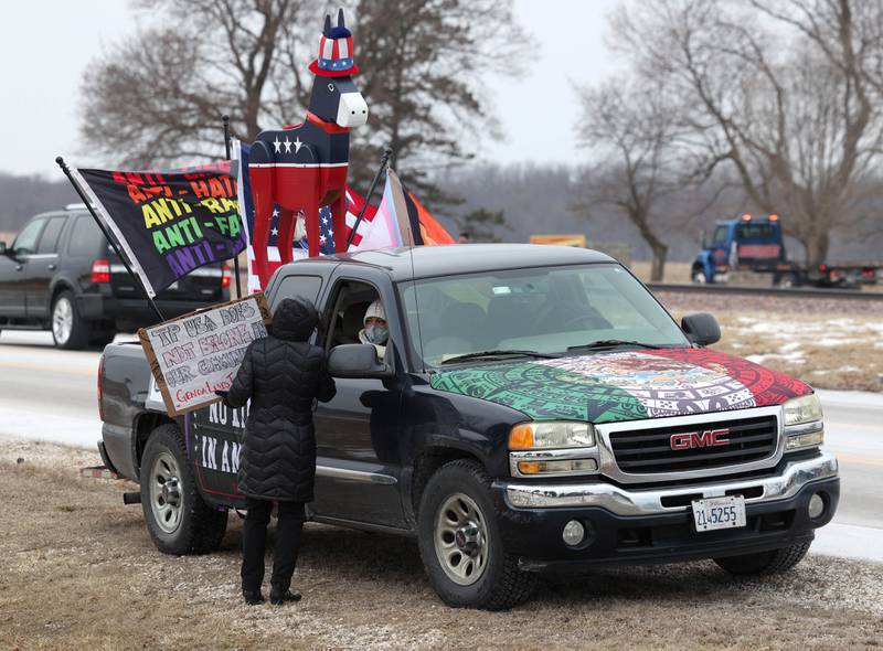A truck decked out in flags and signs pulls up to the protest Thursday, Feb. 5, 2026, in front of Genoa-Kingston High School. The group is protesting the “History Rocks” assembly which is part of a nationwide campaign by the U.S Department of Education tied to the nation’s 250th anniversary and organized by the high school’s Turning Point USA, Club America chapter, a nonprofit founded in 2012 by the late Charlie Kirk.