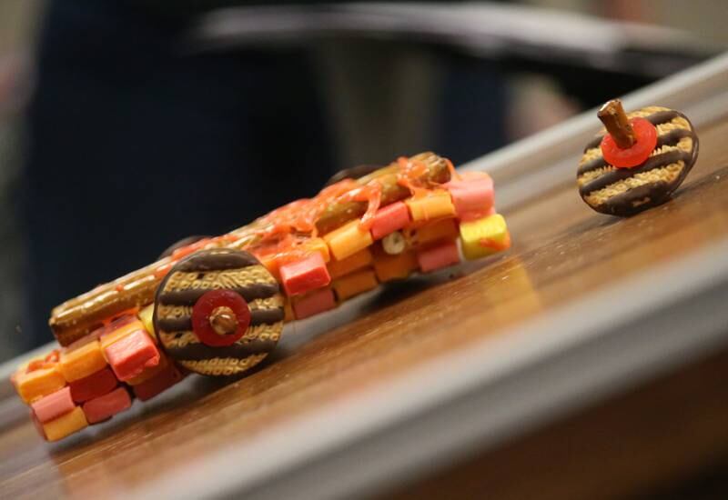 A wheel falls off of an edible car during the 18th annual Editable Car Contest on Wednesday, Feb. 28, 2024 at Illinois Valley Community College in Oglesby.