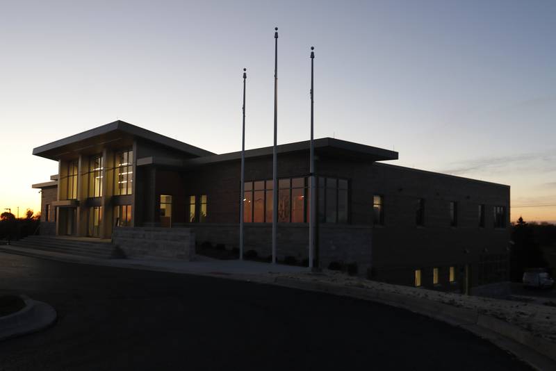 The new Cary Municipal Center is seen at dawn on Monday, Nov. 22, 2021 in Cary. Village officials and police have not yet moved, as the building is not finished, but the construction fencing surrounding the new building are gone, allowing for a better view of the building.