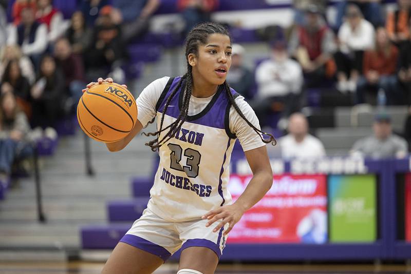 Dixon’s Ahmyrie McGowan handles the ball against Byron Saturday, Dec. 27, at the Duchesses Basketball Christmas Classic.