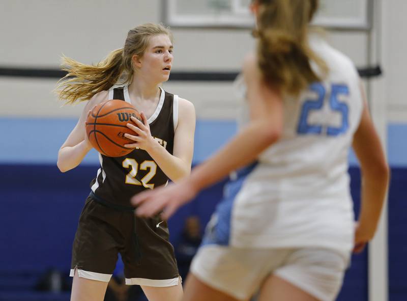 armel's Molli Ward (22) looks for an outlet against Nazareth's Amalia Dray (25) during the girls varsity basketball game between Carmel High School and Nazareth Academy on Wednesday, Dec. 7, 2022 in LaGrange, IL.