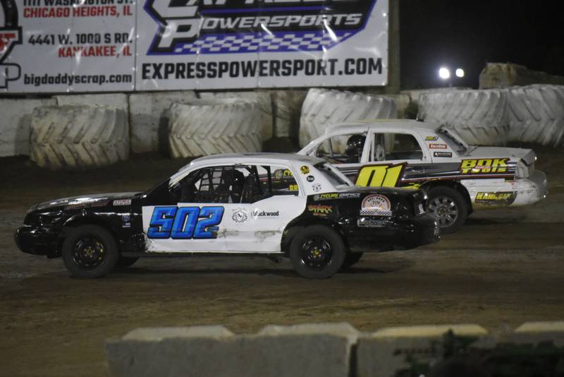Adam Thibo, left, makes a last-lap pass on Phil Blioch for the win in the Crown Victoria feature at Kankakee County Speedway Friday, May 16, 2025.