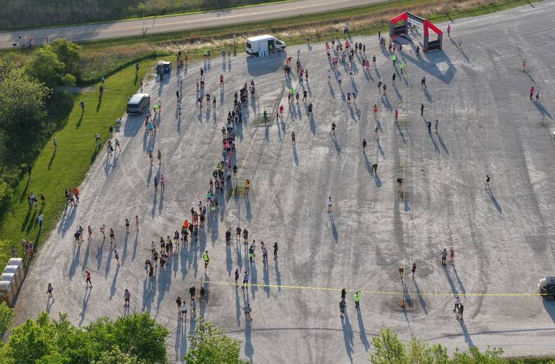 An aerial view of runners gathering at the starting line to begin the Starved Rock Country half-marathon on Saturday, May 10, 2025 at Starved Rock State Park.