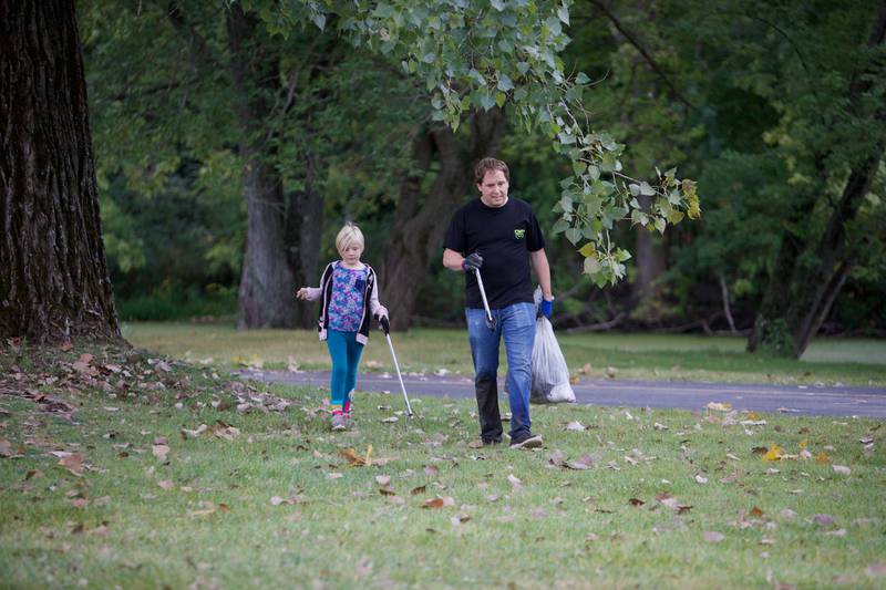 Volunteers pick up garbage during the Fox River cleanup event at Fearson Creek Park on Saturday, Sept. 16,2023 in St. Charles.