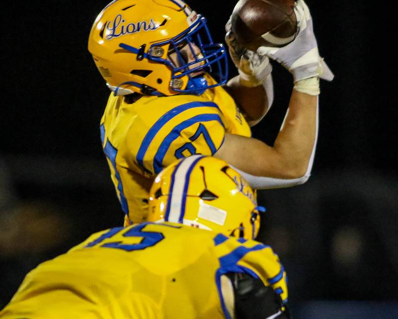Lyon's Brady Rusk (87) comes down with a catch during Class 8A quarterfinal football game between Naperville Central at Lyons on Friday, Nov 15, 2024  in Western Springs.